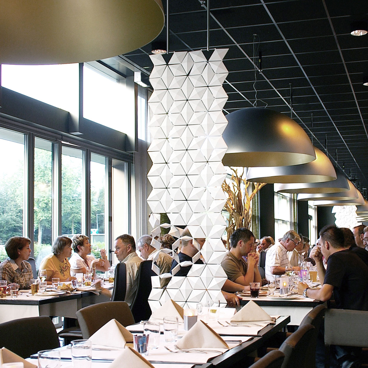 In a restaurant setting, guests often seek a balance: enough privacy to enjoy their conversation, but not so much that they feel cut off