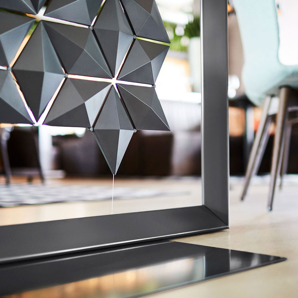 Freestanding restaurant and bar partition with minimal frame and base in a modern interior