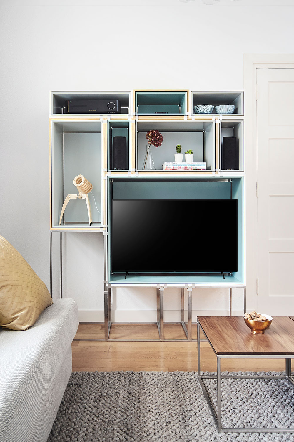 Expose modular shelving system by Bloomming with open wooden frame modules.