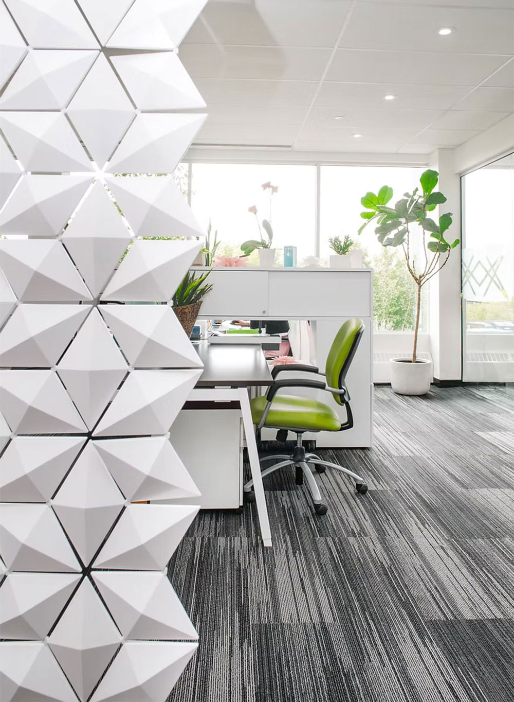 White modular office divider in open workspace interior
